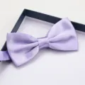 Close-up detail of a elegant lavender satin bow tie neatly placed inside a gift box. - Light Purple Glossy Bowtie