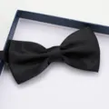Detailed view of a classic black satin bow tie presented in a neat gift box for formal wear. - Classic Black Bow Tie