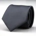 Detailed shot of a rolled dark grey business necktie featuring fine twill texture and classic style. - 8cm Dark Gray Fine Striped Hand-Tied