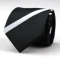 Close-up detail of a classic black necktie featuring a bold white diagonal stripe pattern. - 8cm Black and White Striped Hand-Tied