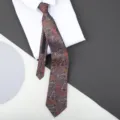 Detail shot of classic paisley pattern zipper tie paired with crisp white dress shirt. - 8cm Auspicious Cloud Phoenix Zipper