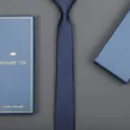 Detailed close-up of a classic navy blue striped necktie presented inside an elegant gift box. - 6cm Sea Breeze Blue Zipper (With Long Gift Box)