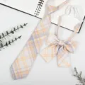 Detail shot of Japanese college style plaid necktie and bow tie set in yellow and purple tones. - JK001 Lemon Yellow