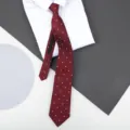 Detail view of burgundy zipper necktie with pink pattern on white shirt backdrop. - 8cm Burgundy Stars Zipper