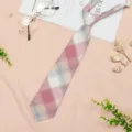 Detailed view of a stylish JK academy style plaid pre-tied necktie with soft fabric texture. - JK017 Little Camellia Necktie