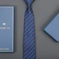Detailed shot of a classic navy blue striped tie with gift box, perfect for business formal wear. - Striped Zipper Style (Long Gift Box) / 8cm Wide / Diamond Blue