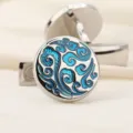 Boutons de manchette élégants pour hommes et femmes au motif tourbillon bleu stylé. - Vague Argent
