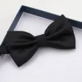 Close up of a black textured bow tie in a gift box, perfect for formal wear and weddings. - Black Grid Bowtie