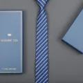 Close-up detail of a classic blue striped necktie paired with a matching elegant gift box. - 6cm A02 Zipper (With Long Gift Box)