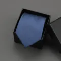 Detail shot of a classic solid blue tie in a black gift box for business formal suit wear. - 8cm Navy Solid Zipper Without Box
