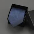 Detailed view of the blue patterned necktie neatly packed in an elegant black gift box. - 8cm Blue Swirl Pattern Zipper Without Box