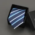 Close-up detail of a classic blue striped necktie neatly folded inside a black gift box. - 8cm Fashion Blue Stripe Zipper Without Box