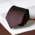 Dark red striped necktie detail shot, rolled up neatly on clean white paper background. - Hand-Tied / 8cm / Elegant Burgundy