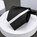 Classic mens black necktie featuring a stylish white diagonal stripe for formal business wear. - Black and White Striped Zipper Necktie