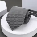 Close-up view of the classic black and white striped business tie texture and neat fold detail. - Black and White Fine Striped Zipper Necktie
