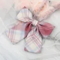 Japanese style JK plaid bow tie detail shot, showing fabric texture and ribbon accessory. - Blue Pink Beige Plaid