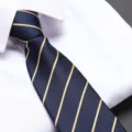 Close-up detail view of classic navy blue men's necktie with elegant gold diagonal stripes. - 8cm Aesthetic Gold Striped Zipper Tie