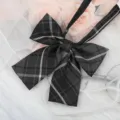 Detailed shot of black plaid JK bow tie, perfect for school uniform shirts and collars. - JK047 Smoked Gray Plaid Bowtie