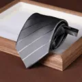 Detail shot of a grey striped zipper tie, neat lazy necktie design for men's business wear. - 8cm Dark Stripe Zipper Style / Light Gray