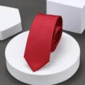 Close-up detail of a classic red narrow tie featuring fine twill texture for formal wear. - 6cm H013