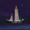 Close-up of the gold rhinestone sailboat brooch, showing sparkling crystal details. - Sailing Boat Gold Color