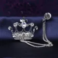 Close-up view of silver crown brooch with crystal chain detail for men suit collar decoration. - Silver Crown with Chain