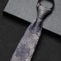 Close-up detail of a blue paisley zipper necktie, elegant business formal accessory for men. - 8cm Camel Paisley Zipper Style