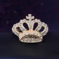 Close-up detail of a vintage gold crown brooch with sparkling rhinestones for men suits. - Gold Crown