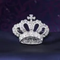 Crystal crown brooch detail shot, sparkling rhinestones on silver tone metal pin ornament. - Crown Silver