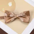 Close-up of mens vintage brown floral jacquard bow tie, fine textured double layer fabric detail. - Floating Light Dream Weaving Bow Tie