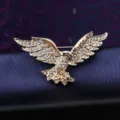 Detailed view of vintage men's eagle rhinestone brooch, elegant suit accessory and lapel pin. - Eagle Gold