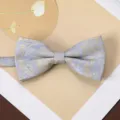 Men's retro jacquard bow tie detail, elegant gold paisley pattern on light blue fabric. - Mist Blue Gold Pattern Bow Tie