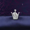Close-up of silver crown brooch with sparkling rhinestones, detailed craftsmanship pin badge. - Small Crown Silver