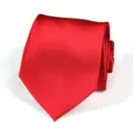 Close-up of a classic wine red silk necktie, neatly folded to show its smooth texture. - Bright Red Glossy
