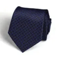 Detailed shot of a stylish blue and black geometric patterned mens business dress necktie. - Blue Pattern