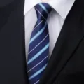 Classic men's blue striped tie with white shirt and black suit for business formal wear. - Versatile Blue Stripe