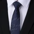 Detailed view of men's dark blue business tie with subtle pattern, ideal for formal wear. - Blue Shooting Star