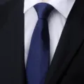 Close-up of a dark blue men's business formal tie with subtle geometric lines. Ideal. - Blue Snowflake