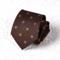 Brown men's tie detail showing neat roll texture with yellow geometric dot pattern. - Handmade Style / 8cm / Coffee Gold Small Square