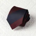 Closeup of a classic men's diagonal striped tie, showing fine texture and rolled shape details. - Handmade Style / 8cm / Burgundy and Navy Wide Stripe