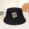 Detail view of black bucket hat featuring colorful creative Rubik cube graphic print. - M (56-58cm) / Black