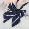 Navy blue JK uniform ribbon bow with white stripes detail close up shot for matching shirts. - Navy Blue Striped Ribbon Bow