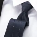 Close-up detail of a dark blue business tie with subtle geometric pattern on crisp white shirt. - 8cm Wave White Dot Zipper