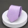 Purple striped tie detail view, elegant textured fabric for formal business wear and suits. - 7