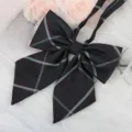 Detailed view of a black plaid JK uniform bow tie, featuring classic stripes and long ribbons. - Black Light Blue Plaid Ribbon Bow