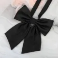 Close-up of black twill JK uniform bow ribbon, showing delicate texture and neat shape. - Black Fine Stripe Ribbon Bow