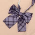 Detailed view of the purple plaid JK bow tie fabric texture and classic pre-tied bow design. - Grape Soda