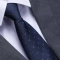 Close-up detail of a blue checkered men's business necktie paired with suit and shirt. - A018 Zipper Style / 8cm