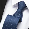Detailed view of classic blue business tie with elegant geometric zigzag pattern for men. - 8cm Blue Ladder Pattern Zipper