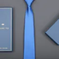 Blue silk necktie detail shot with elegant gift box packaging for formal business wear. - 8cm Royal Blue Solid Zipper (Long Gift Box)